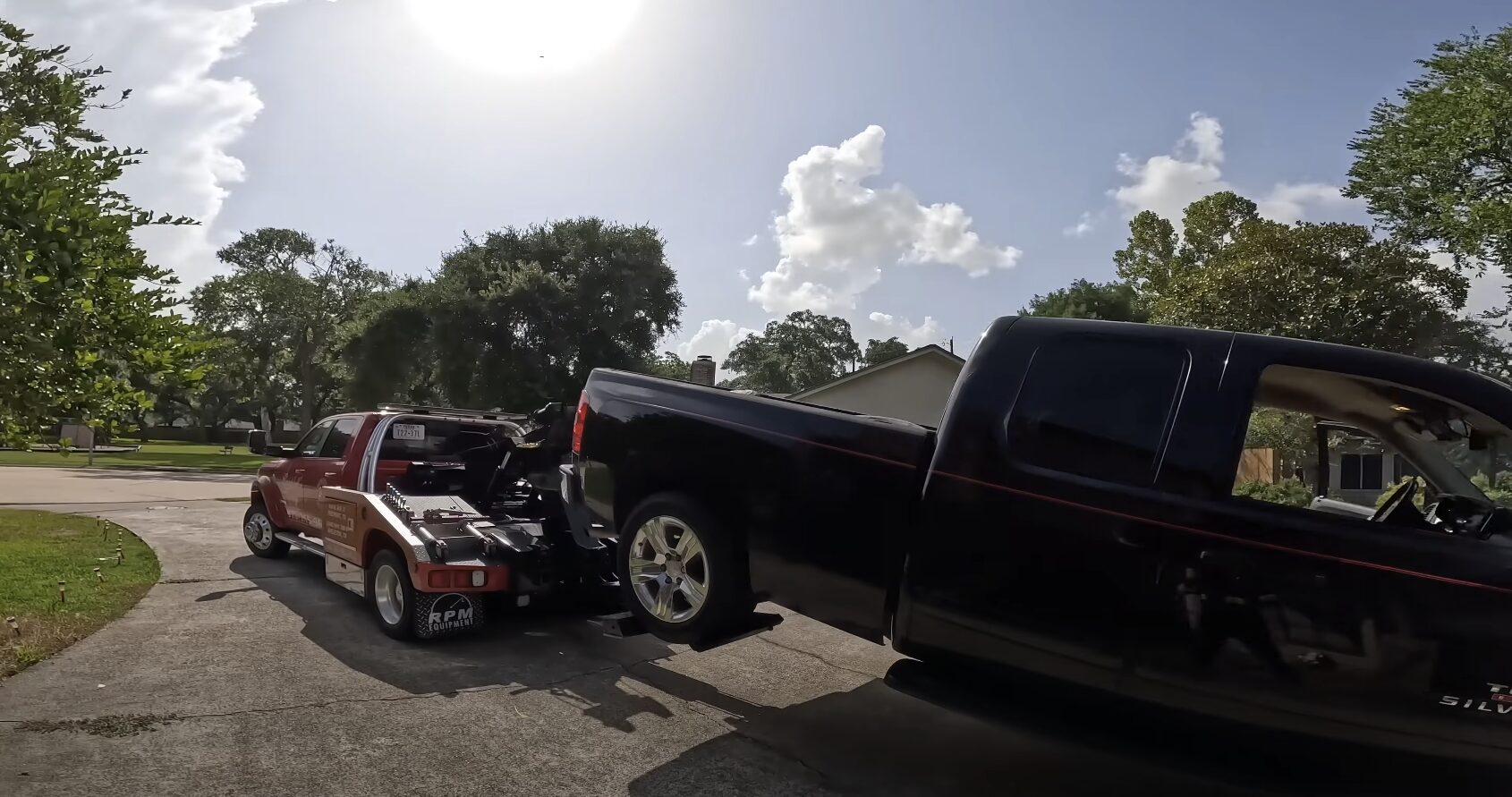 Professional towing service loading vehicle in Garden City NY